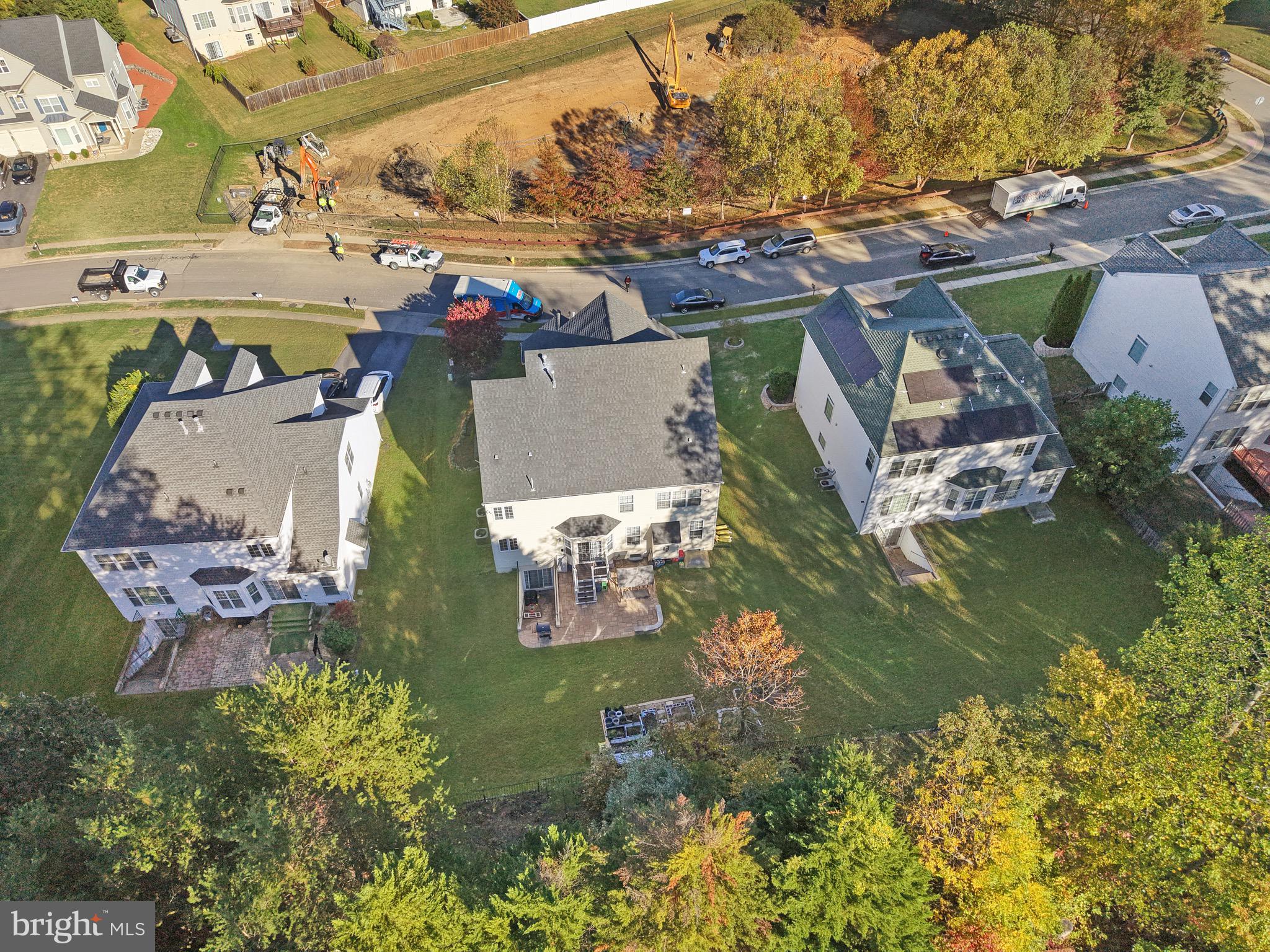 3671 Expedition Drive Triangle, VA 22172 - Photo 54 of 55 a view of a house with a big yard and large trees