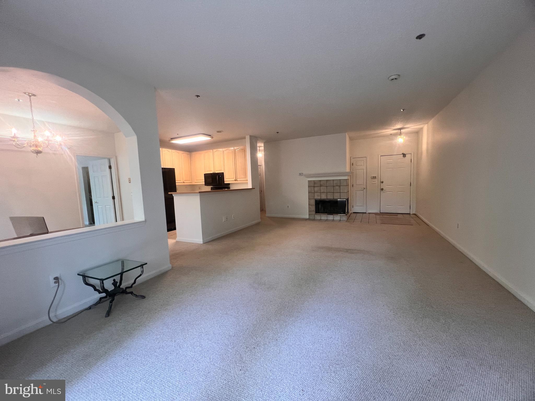 103 Square Rigger Way, Unit 103 Solomons, MD 20688 - Photo 18 of 21 a view of a livingroom with furniture and a kitchen
