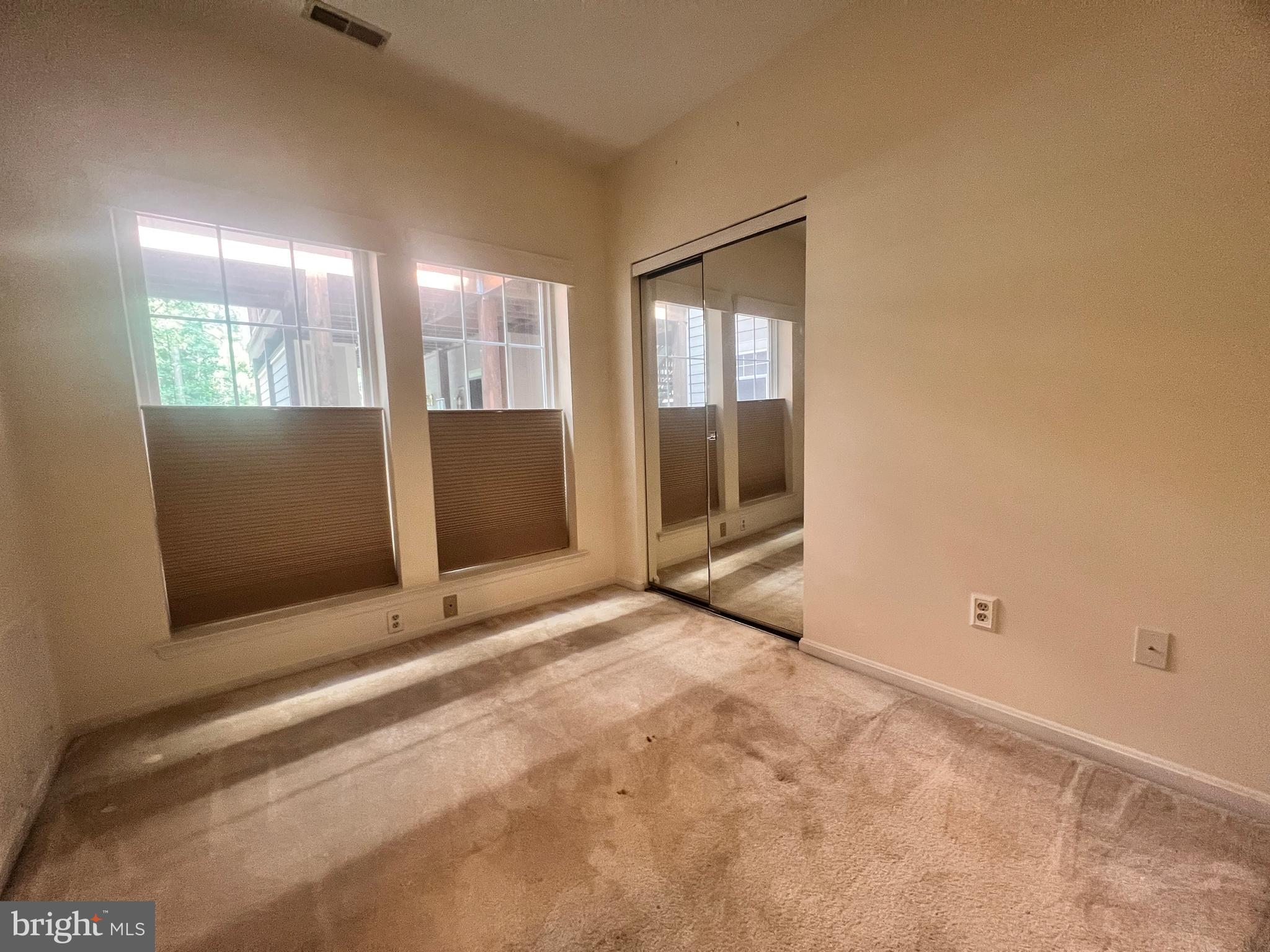 103 Square Rigger Way, Unit 103 Solomons, MD 20688 - Photo 20 of 21 a view of an empty room with a fireplace