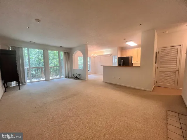 a view of a kitchen with a sink cabinets and a couch
