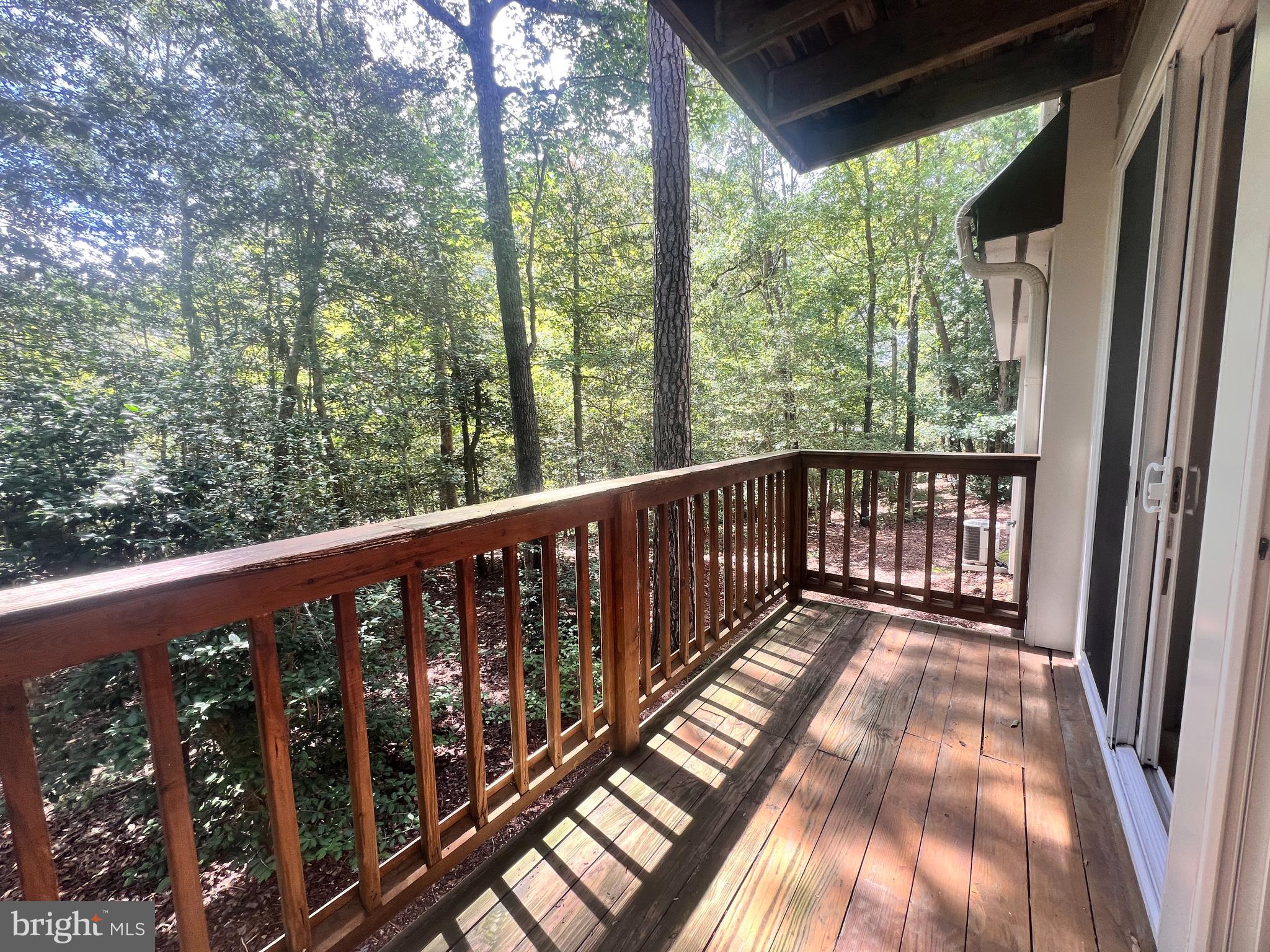 103 Square Rigger Way, Unit 103 Solomons, MD 20688 - Photo 3 of 21 a view of balcony with wooden floor