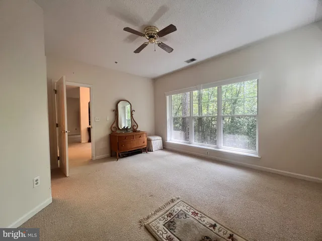 a bathroom with a sink toilet a mirror and shower