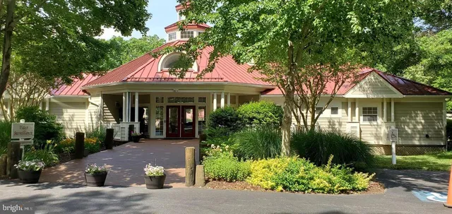 an aerial view of a house with an outdoor space