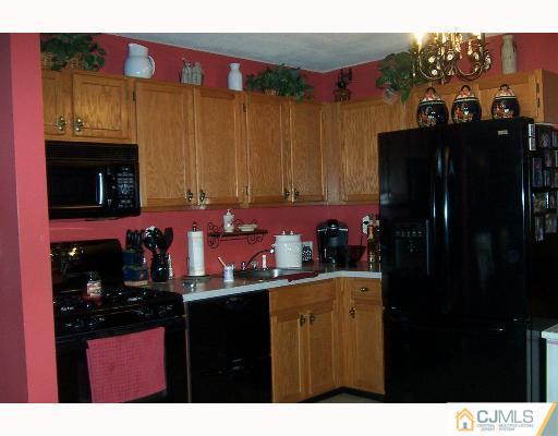 2 Durham Road Edison, NJ 08817 - Photo 3 of 8 a kitchen with a refrigerator and a sink