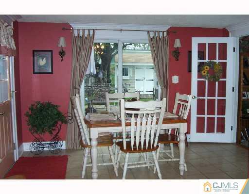 2 Durham Road Edison, NJ 08817 - Photo 4 of 8 a view of a dining room with furniture and chandelier