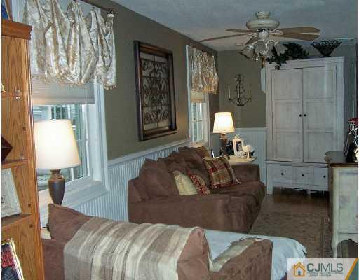 2 Durham Road Edison, NJ 08817 - Photo 5 of 8 a living room with furniture and a lamp