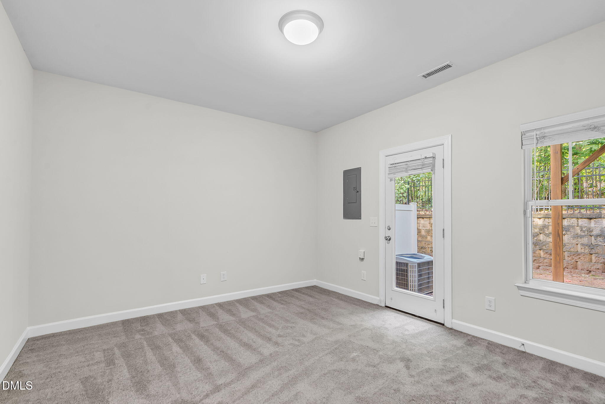 8032 Sycamore Hill Lane Raleigh, NC 27612 - Photo 10 of 59 an empty room with windows