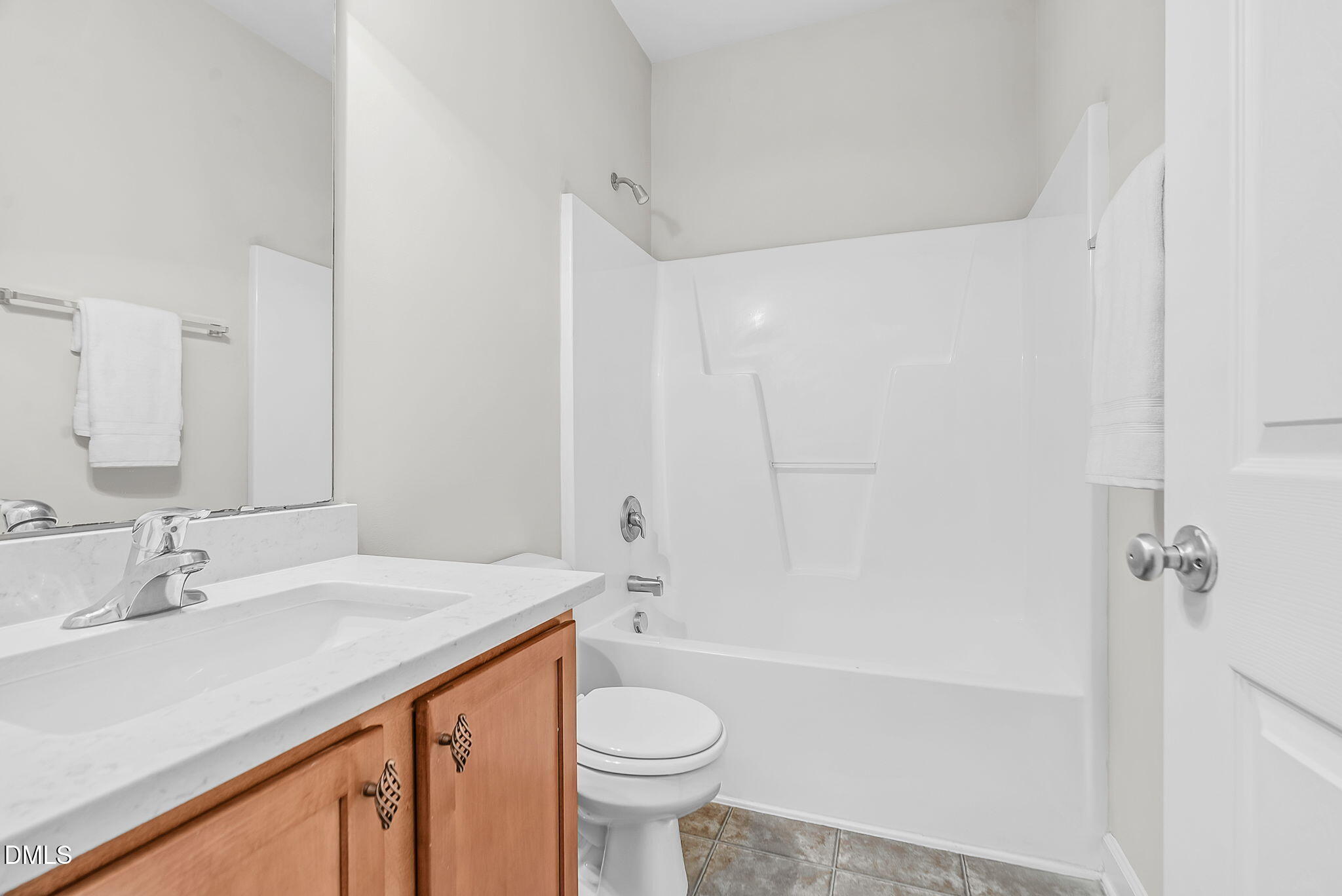 8032 Sycamore Hill Lane Raleigh, NC 27612 - Photo 13 of 59 a bathroom with a sink a toilet and shower