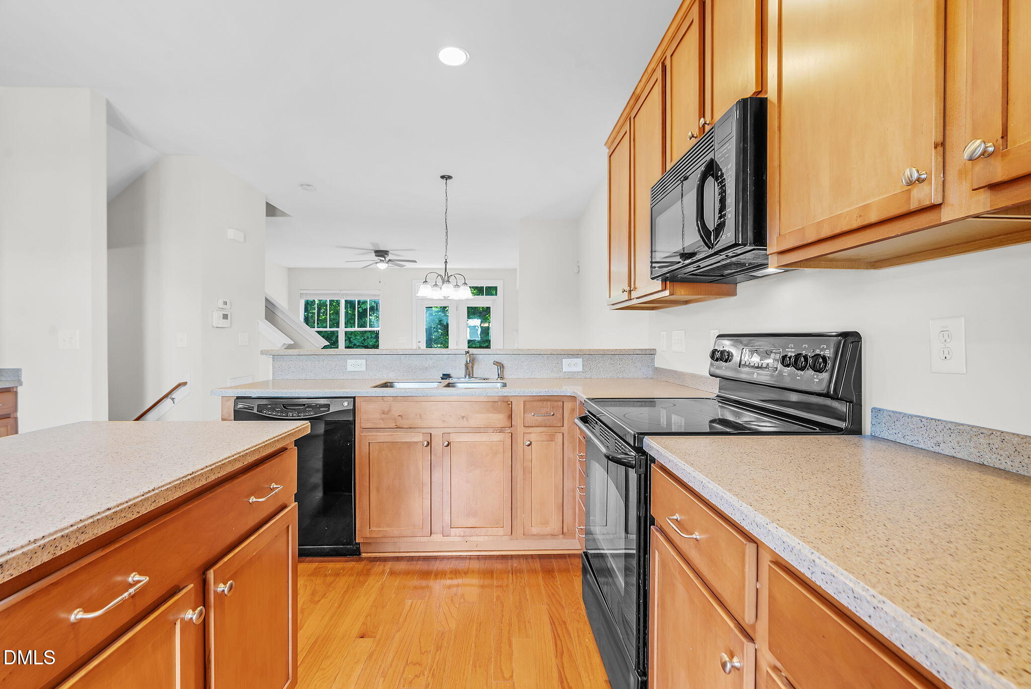 8032 Sycamore Hill Lane Raleigh, NC 27612 - Photo 24 of 59 a kitchen with stainless steel appliances granite countertop a sink and cabinets