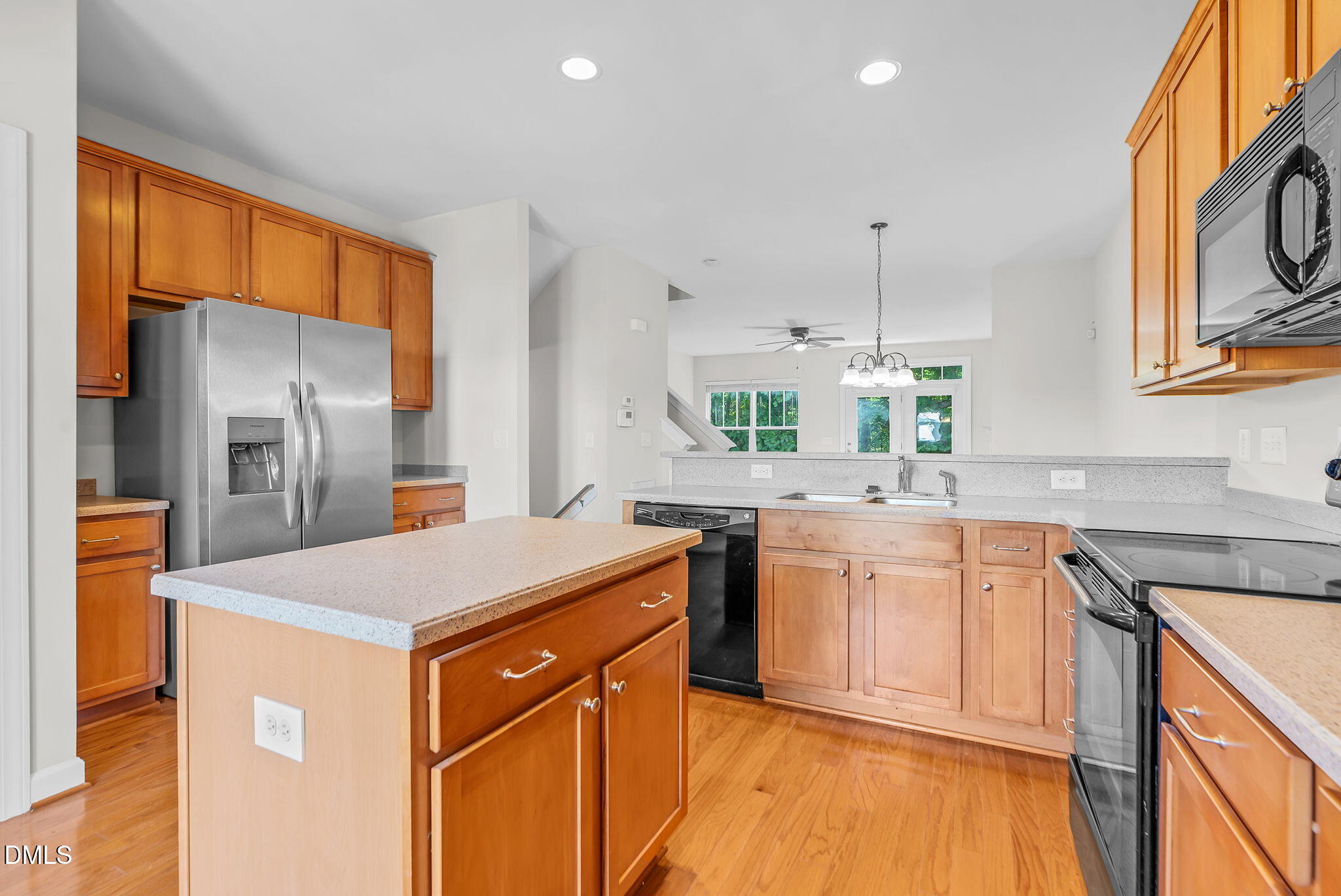 8032 Sycamore Hill Lane Raleigh, NC 27612 - Photo 25 of 59 a kitchen with stainless steel appliances a sink stove and refrigerator