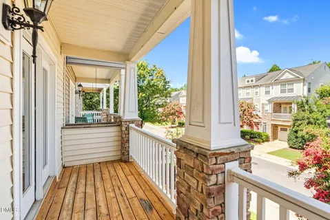 a view of a livingroom with wooden floor and stairs