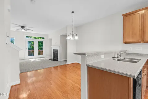 a view of a livingroom with a ceiling fan and window