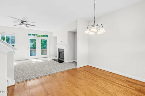 a view of an empty room with a fireplace