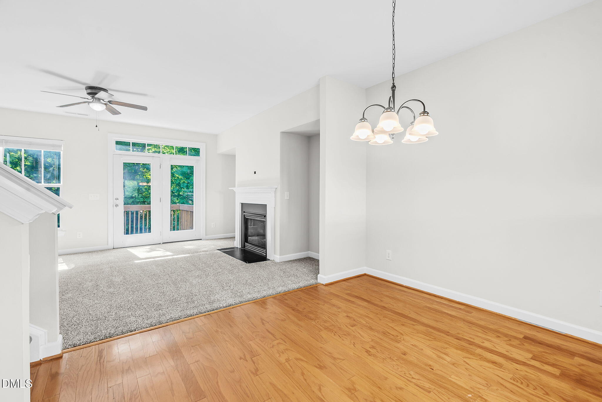 8032 Sycamore Hill Lane Raleigh, NC 27612 - Photo 33 of 59 a view of a livingroom with a chandelier fan and windows