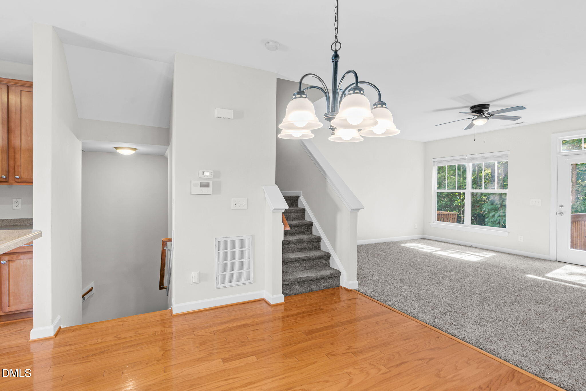 8032 Sycamore Hill Lane Raleigh, NC 27612 - Photo 36 of 59 a view of a livingroom with wooden floor and stairs