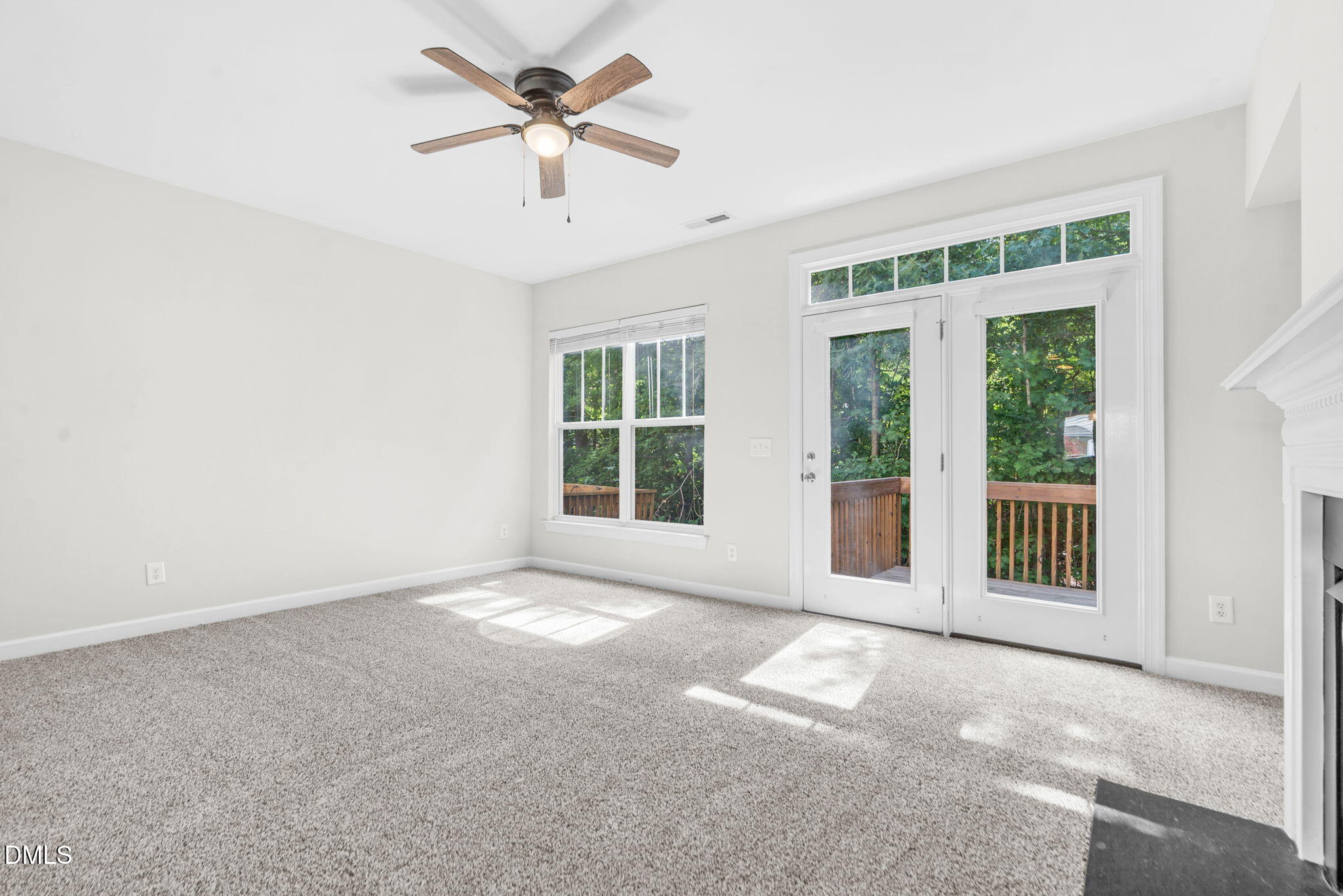 8032 Sycamore Hill Lane Raleigh, NC 27612 - Photo 37 of 59 a view of a livingroom with a ceiling fan and window