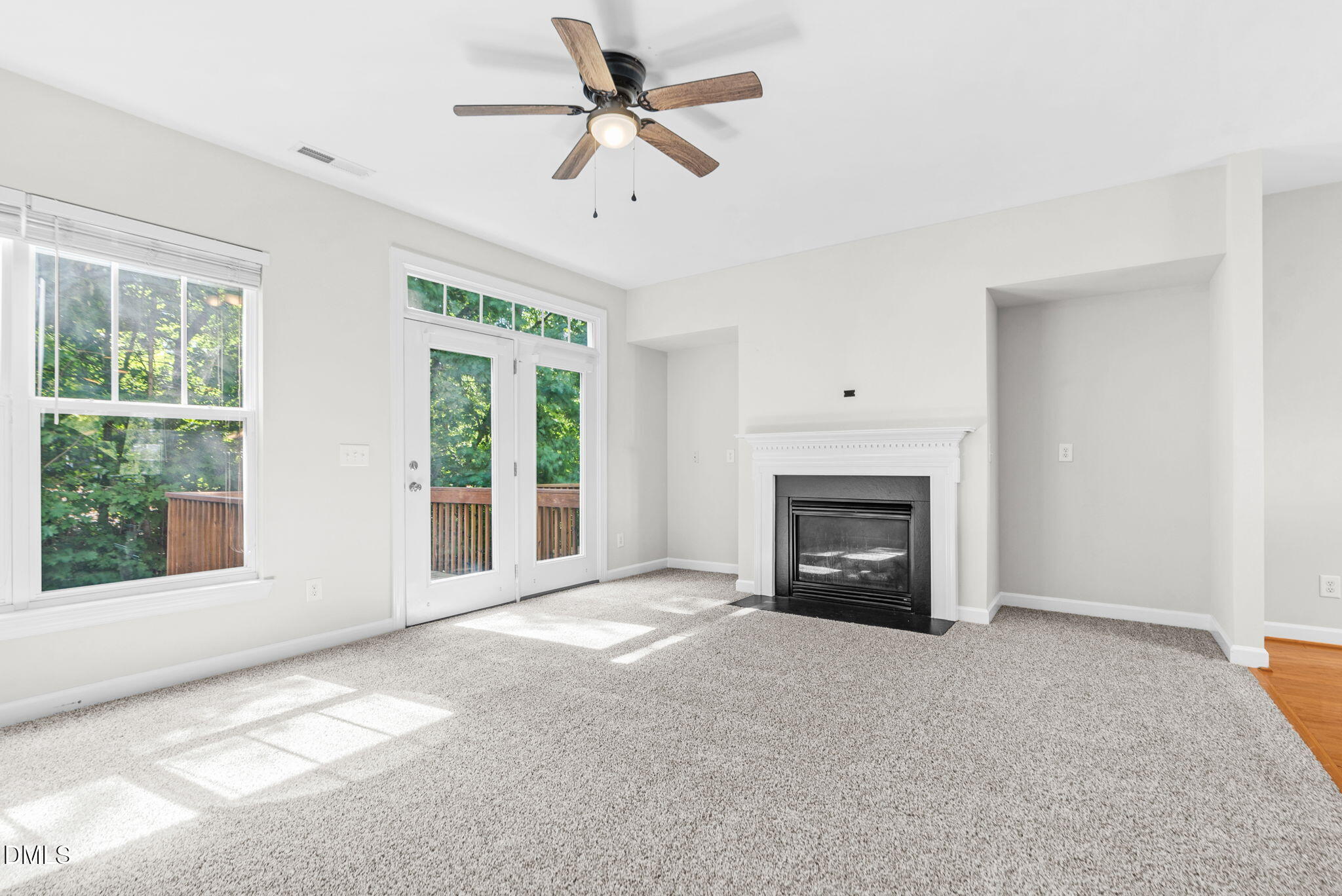 8032 Sycamore Hill Lane Raleigh, NC 27612 - Photo 38 of 59 a view of an empty room with a fireplace and a window
