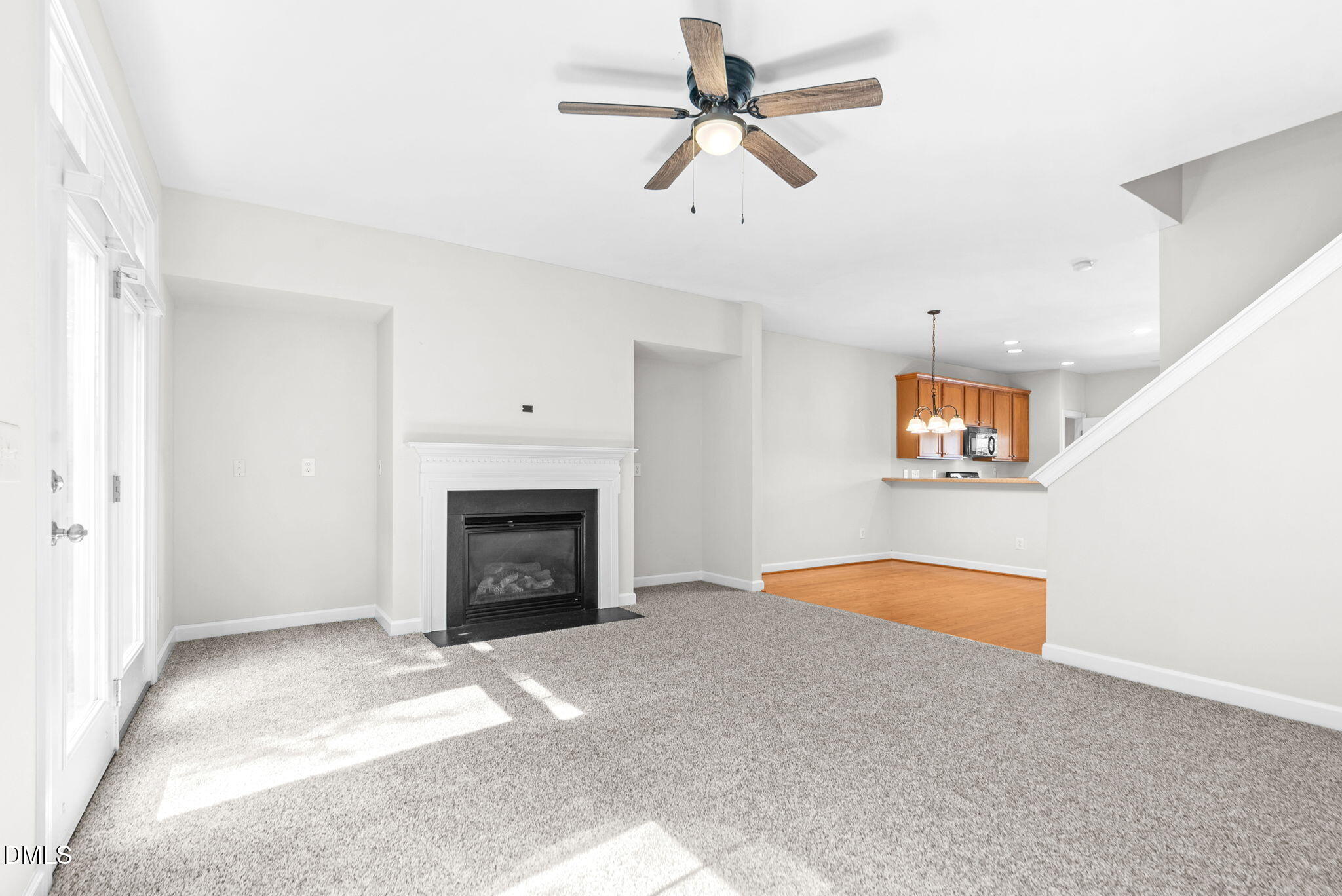8032 Sycamore Hill Lane Raleigh, NC 27612 - Photo 39 of 59 a view of an empty room with a fireplace