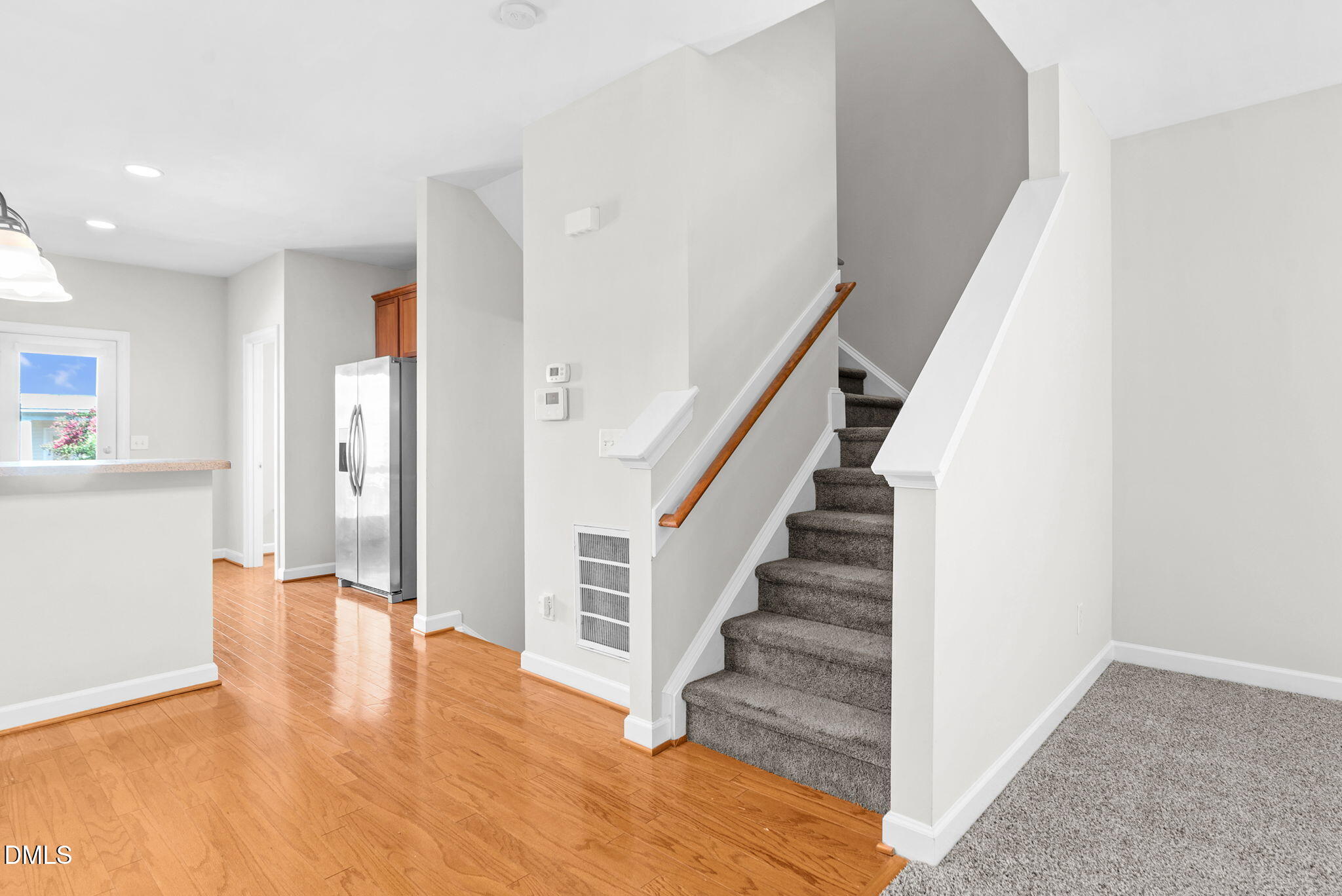 8032 Sycamore Hill Lane Raleigh, NC 27612 - Photo 42 of 59 a view of entryway and hall with wooden floor