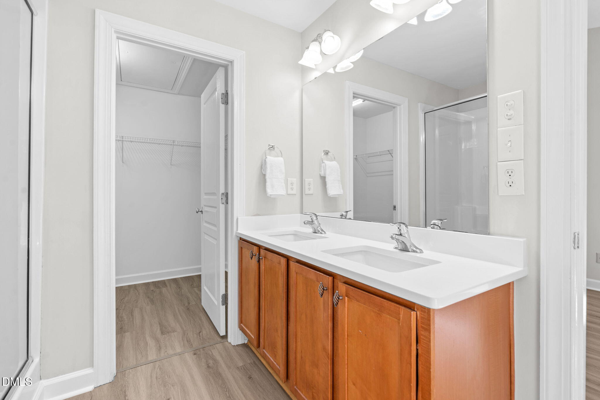 8032 Sycamore Hill Lane Raleigh, NC 27612 - Photo 48 of 59 a bathroom with 2 sink and a mirror
