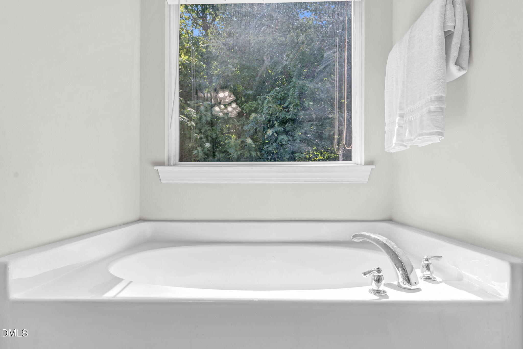 8032 Sycamore Hill Lane Raleigh, NC 27612 - Photo 49 of 59 a white bath tub sitting next to a window