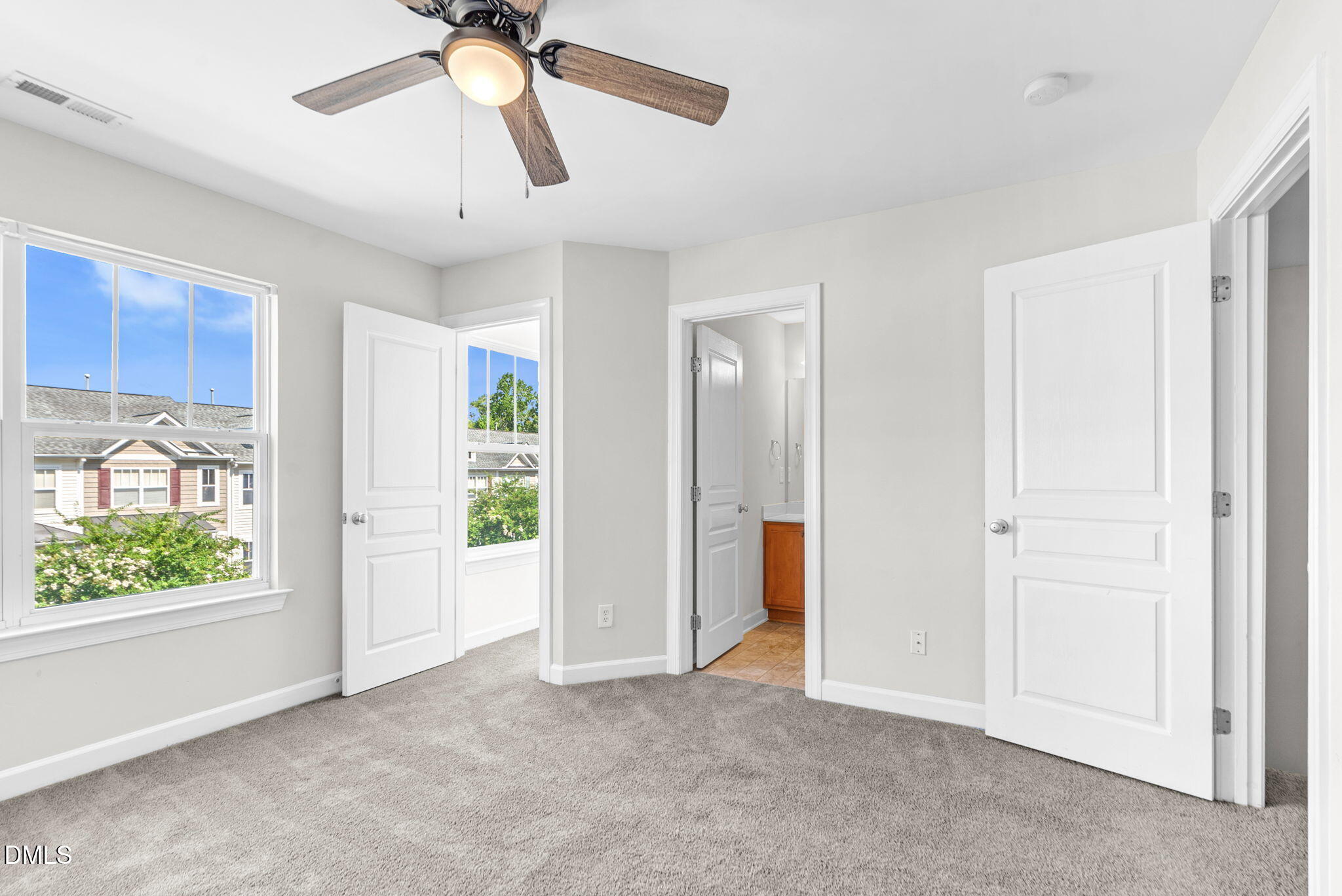 8032 Sycamore Hill Lane Raleigh, NC 27612 - Photo 51 of 59 a view of empty room with window and ceiling fan