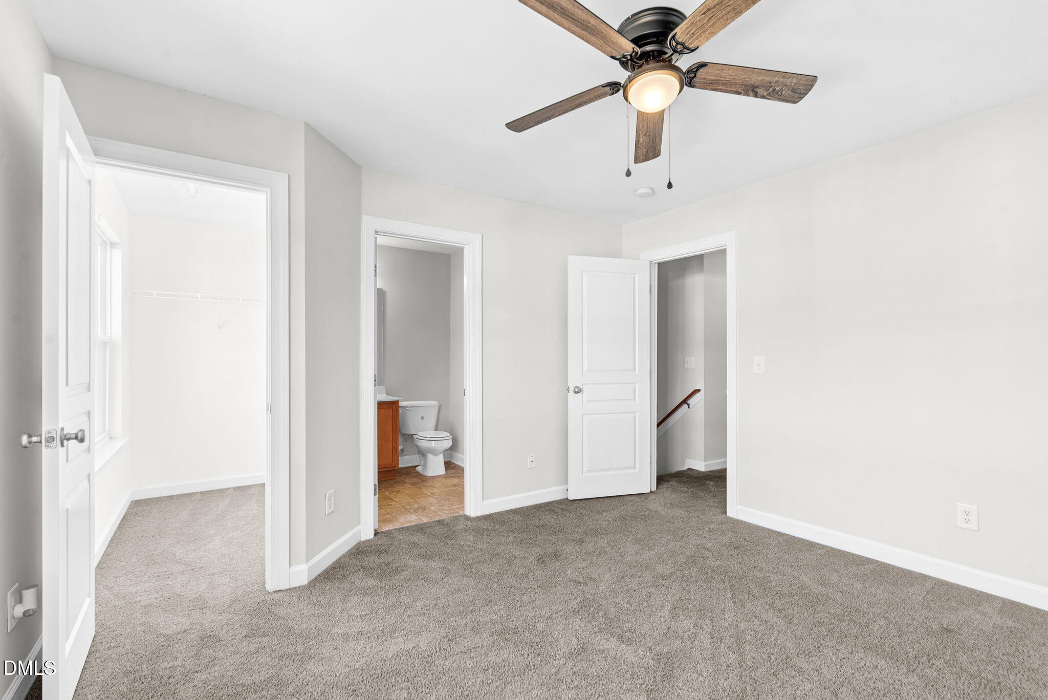 8032 Sycamore Hill Lane Raleigh, NC 27612 - Photo 53 of 59 a view of a hallway with a chandelier fan