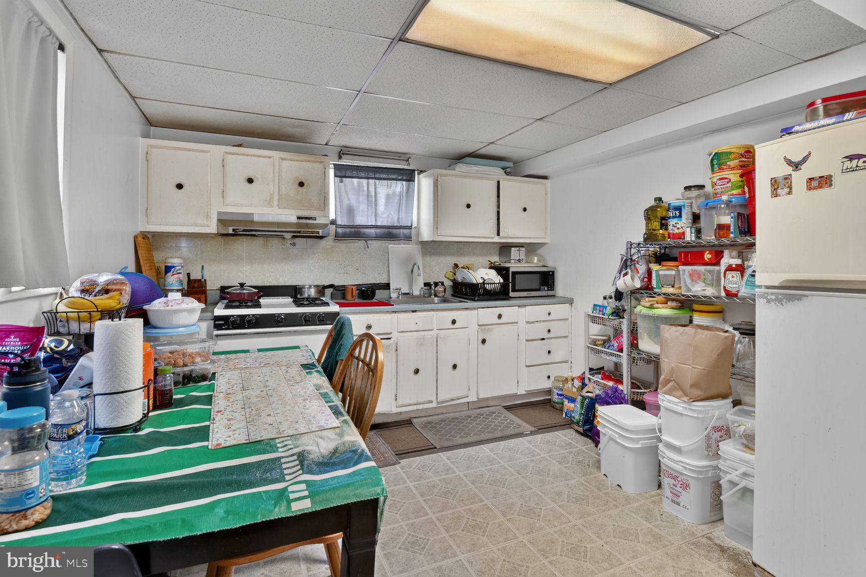 1207 Oakview Drive Silver Spring, MD 20903 - Photo 15 of 25 Cozy kitchen with ample storage space.