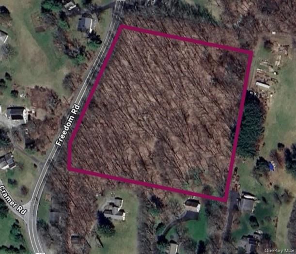 a view of a street with a tree