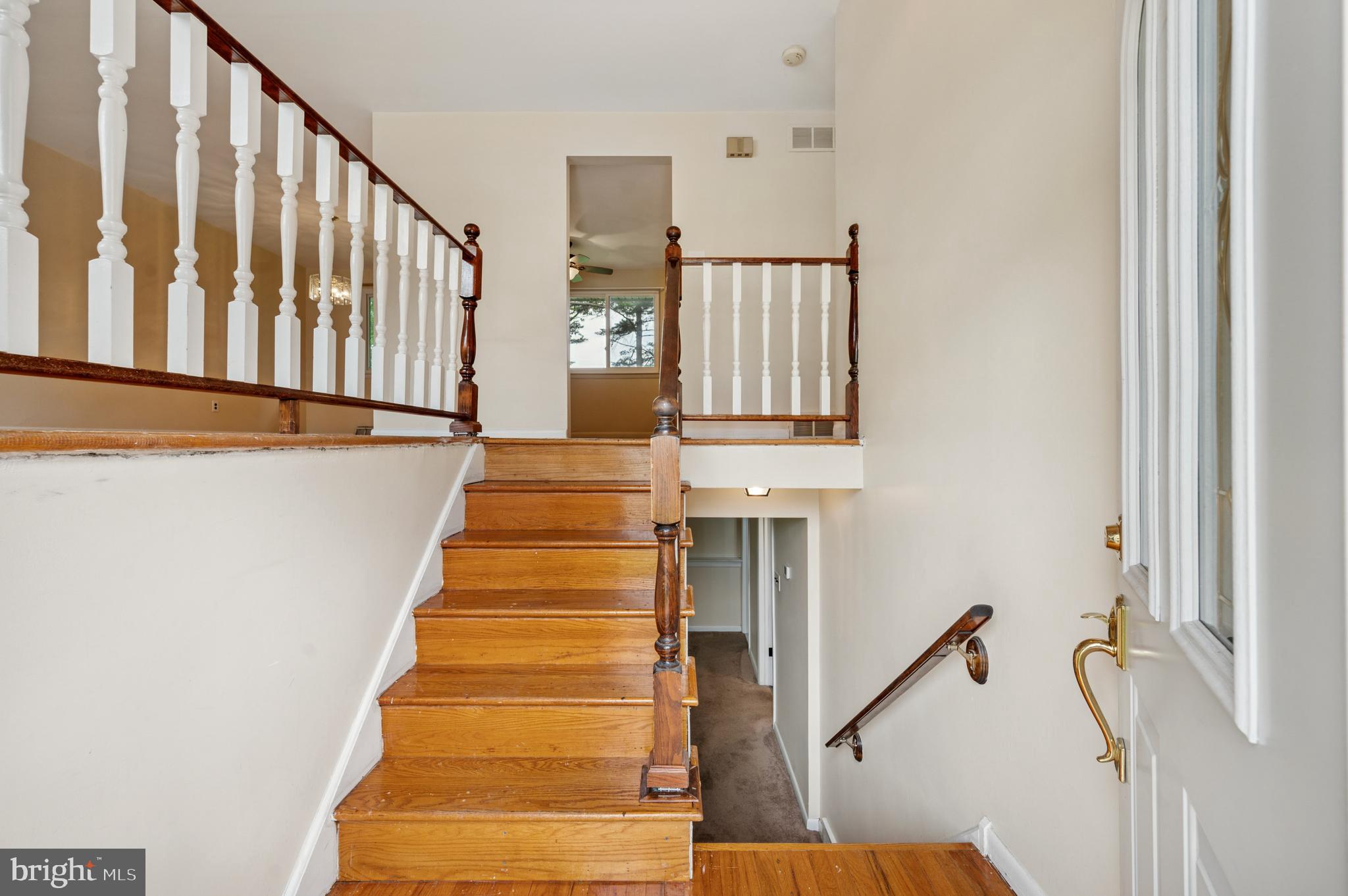 26 Anvil Road Aston, PA 19014 - Photo 3 of 30 a view of staircase with lots of frames on wall and a window
