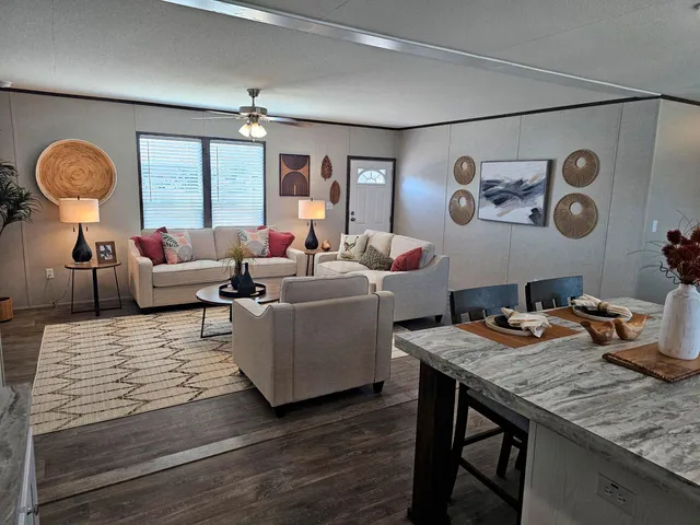 a living room with furniture and a table