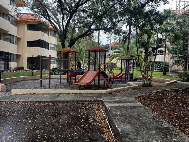 a view of swimming pool and trees in the background