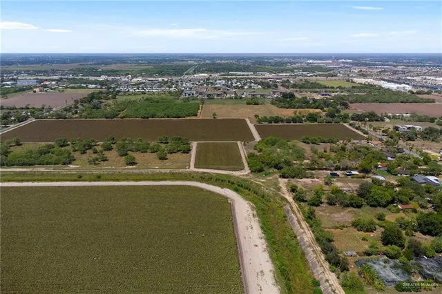 an aerial view of a house with a lake view