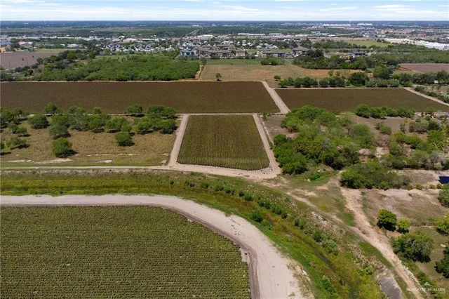 an aerial view of a house with a lake view