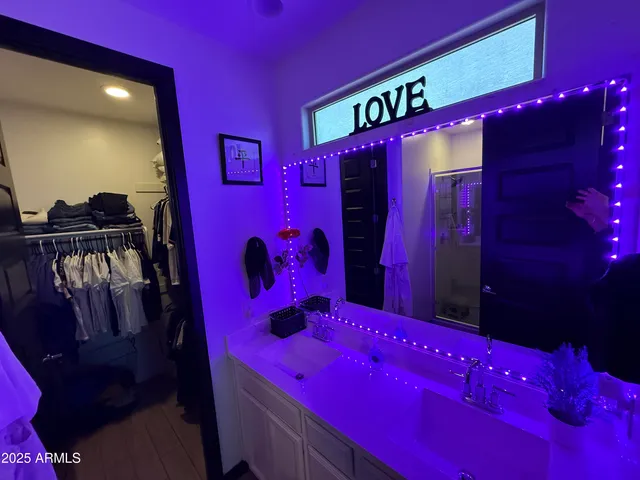 a room with a bed and wooden floor