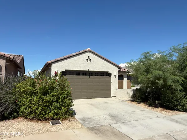 a house with trees in the background