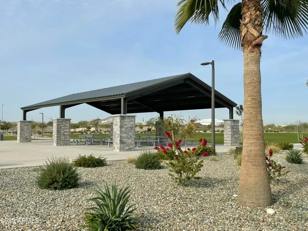 a view of a park with sitting area