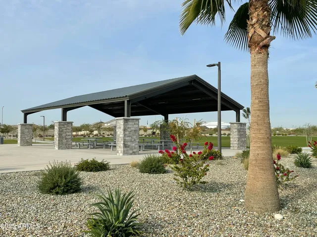 a view of a park with sitting area