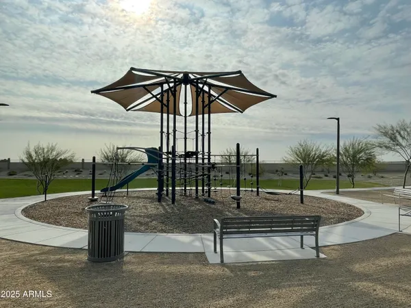 a view of a patio with table and chairs potted plants with lake view