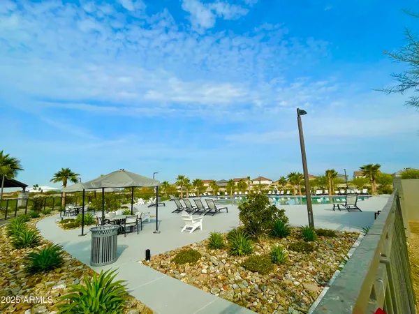 a view of swimming pool with outdoor seating