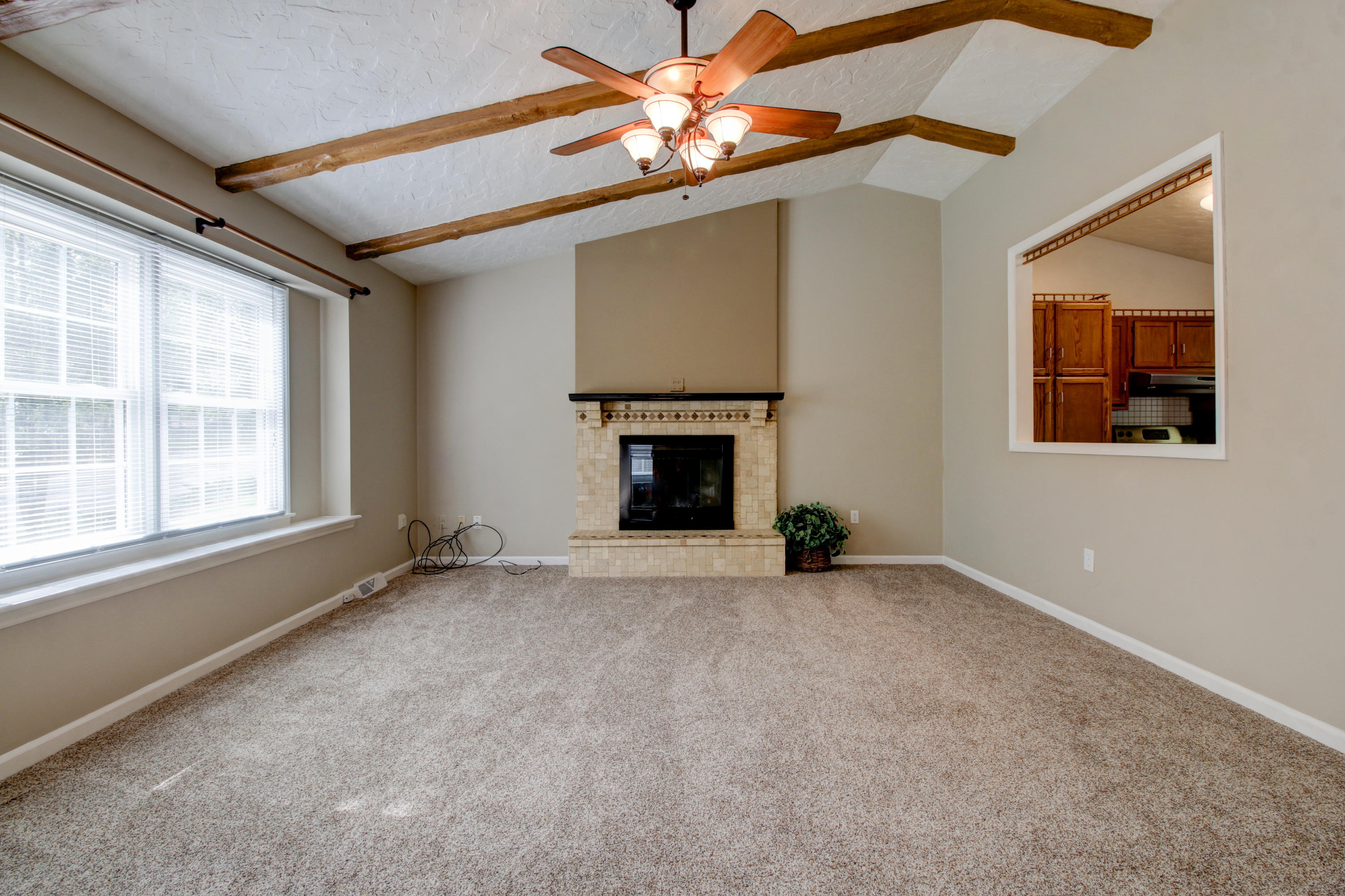 1396 Mountain Pass Road Blue Ridge, VA 24064 - Photo 3 of 28 an empty room with windows and fireplace