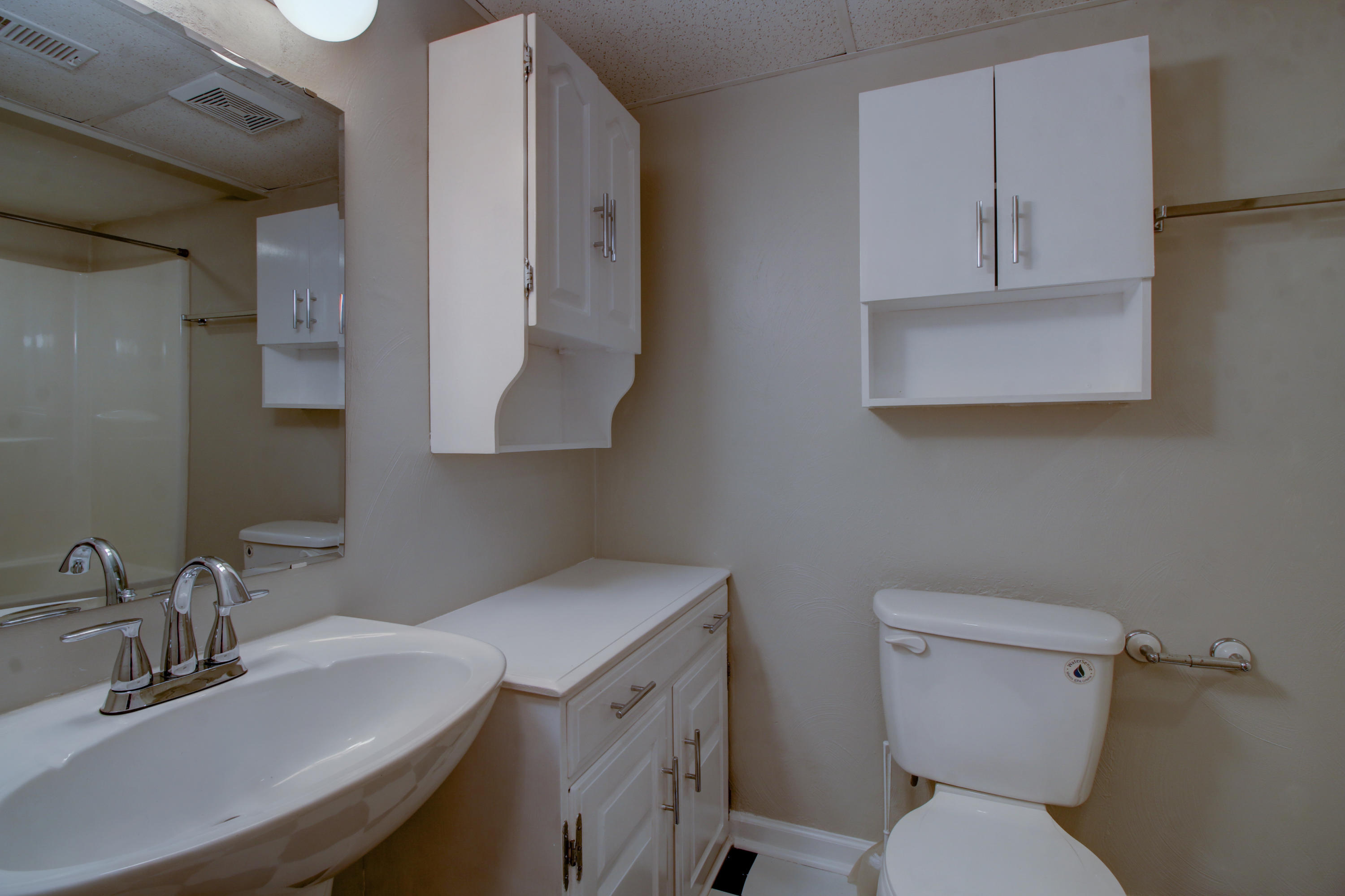 1396 Mountain Pass Road Blue Ridge, VA 24064 - Photo 22 of 28 a bathroom with a toilet sink and mirror