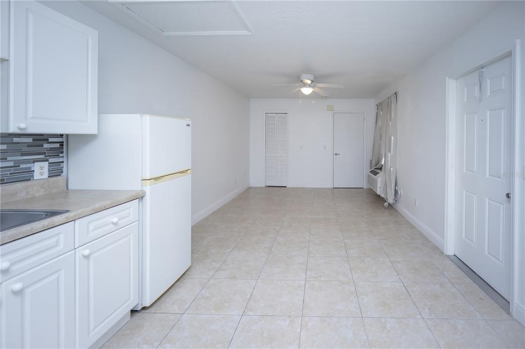 234 Mango Drive, Unit B Davenport, FL 33897 - Photo 4 of 17 a view of a kitchen with white cabinets