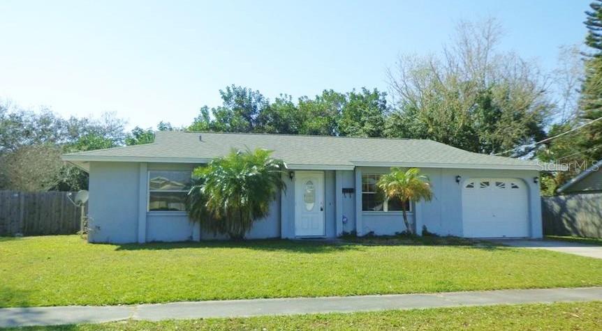 2526 Java Plum Avenue Sarasota, FL 34232 - Photo 1 of 1 a house view with a garden space