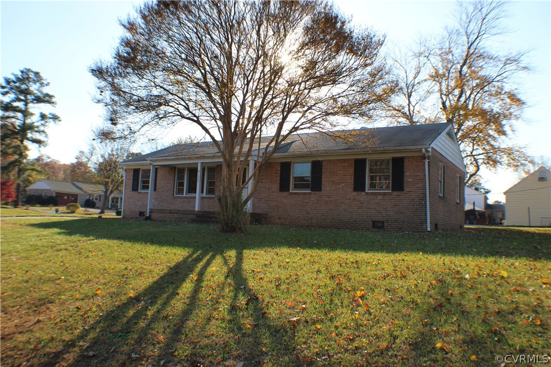 8132 Concho Road North Chesterfield, VA 23237 - Photo 1 of 32 a view of a yard with a house and a large tree