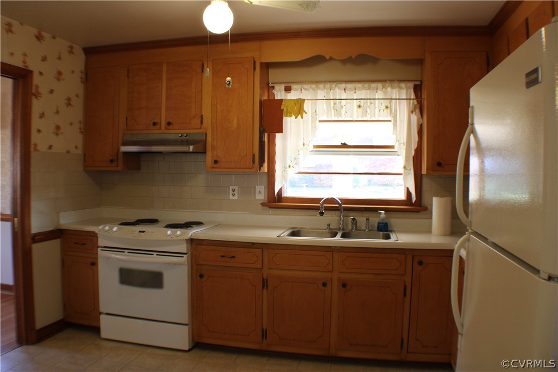 8132 Concho Road North Chesterfield, VA 23237 - Photo 11 of 32 a kitchen with white cabinets appliances and a window