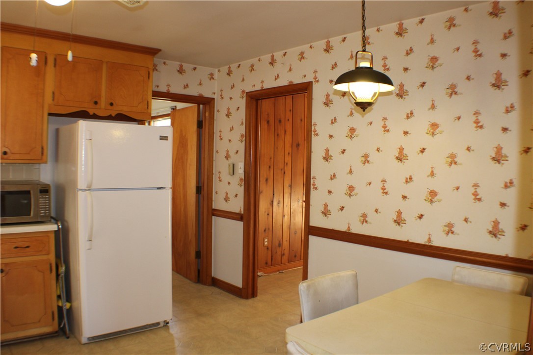 8132 Concho Road North Chesterfield, VA 23237 - Photo 12 of 32 a kitchen with stainless steel appliances a refrigerator and a stove