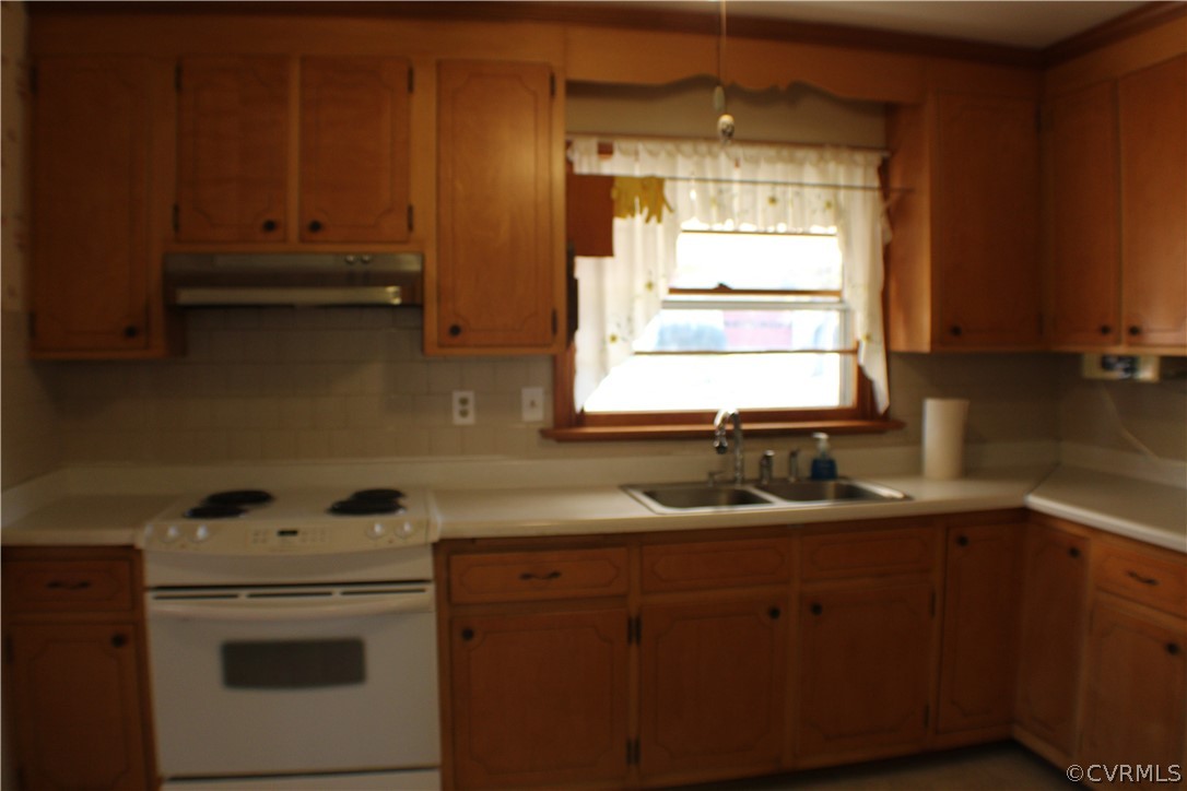 8132 Concho Road North Chesterfield, VA 23237 - Photo 15 of 32 a kitchen with a sink cabinets and window