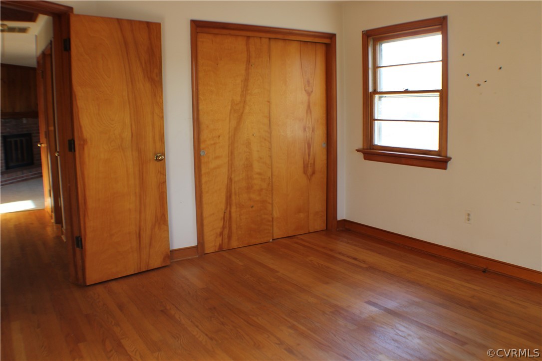 8132 Concho Road North Chesterfield, VA 23237 - Photo 20 of 32 an empty room with wooden floor and closet area