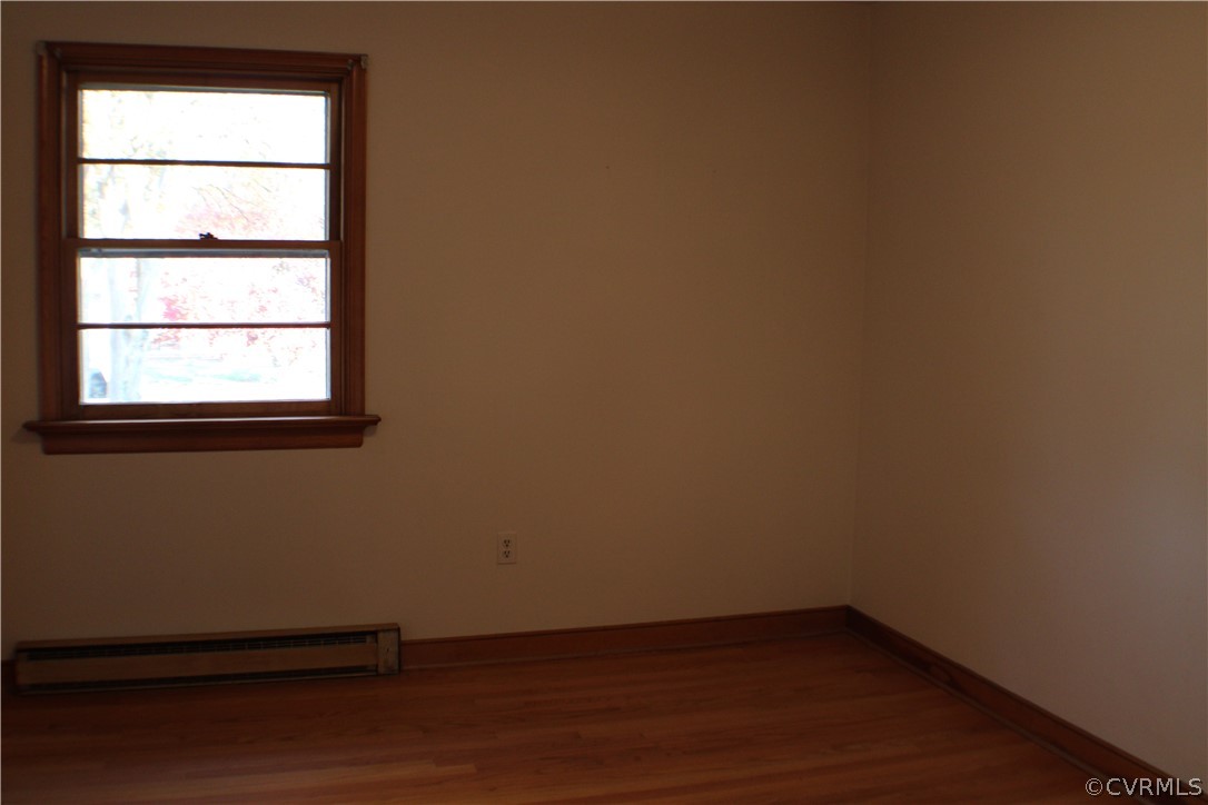 8132 Concho Road North Chesterfield, VA 23237 - Photo 23 of 32 an empty room with wooden floor and windows